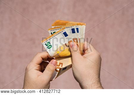 Hand Couting Holding And Showing Euro Money Or Giving Money. World Money Concept, 50 Euro Banknotes 