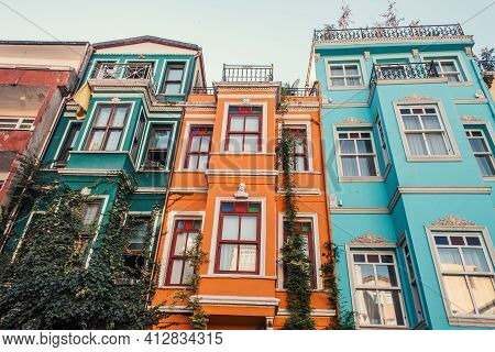Green Ivy On Multicolored, Decorated Houses In Jewish Quarter In Istanbul, Turkey.