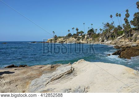 The Coastline at Laguna Beach, California, looking towards Recreation Point, with Heisler Park running along the bluff.