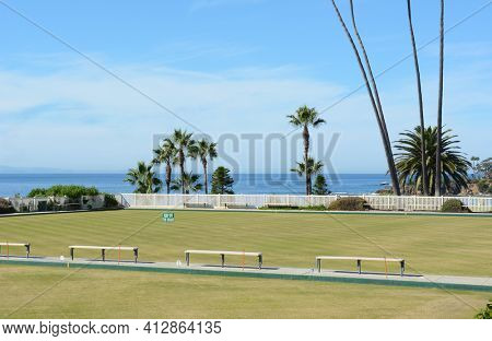 LAGUNA BEACH, CA, NOVEMBER 14, 2016: Laguna Beach Lawn Bowling Club on Cliff Drive. Adjacent to Heisler Park on the bluffs overlooking the Pacific Ocean with Catalina Island in the distance.