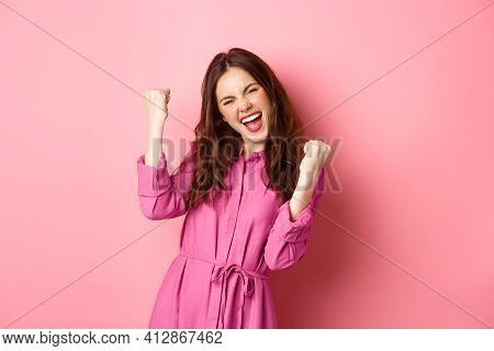 Beautiful Smiling Woman Scream With Happy And Excited Face, Saying Yes, Making Fist Pump, Winning An