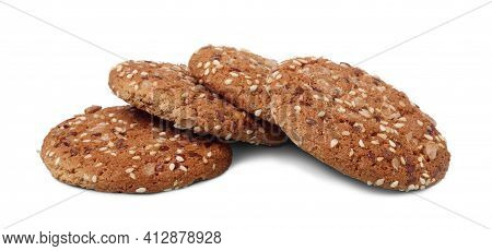 Several Oatcakes With Sunflower And Flax Seeds Isolated On White Background. Concept Of Healthy Food
