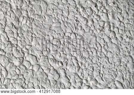 Textured Stucco Background With Scratches, Scuffs And Stains. Uneven Plaster Backdrop Of White And G