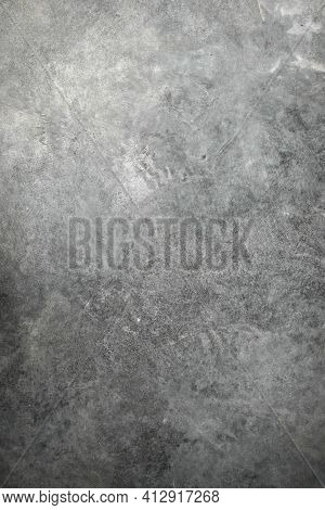 Textured Dark Background With Scratches, Scuffs And Stains. Blank Backdrop Of Gray Color For Copy Sp