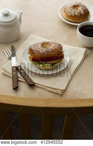 Bagels Breakfast Sandwich With Cucumber And Eggs, Pastry Concept, Morning Coffee Cup At Table And Ch