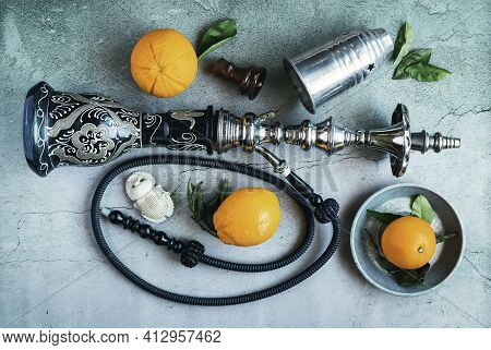 Hookah With Oranges And Egyptian Amulet In The Shape Of A Scarab