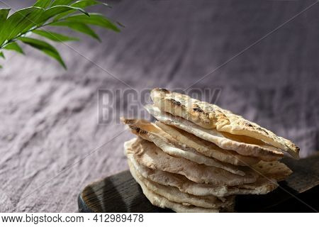 Homemade Matzo  With Microgreen Peas. Unleavened Flatbread Bread. Pesah Celebration Concept.  Jewish