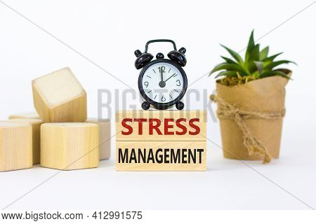 Stress Management Symbol. Wooden Blocks With Words 'stress Management'. Black Alarm Clock, Plant. Be