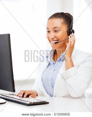 business, office and communication concept - african female helpline operator with headphones