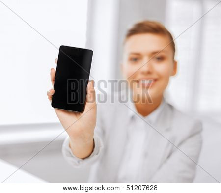 business, office, school and education concept - smiling businesswoman with smartphone in office