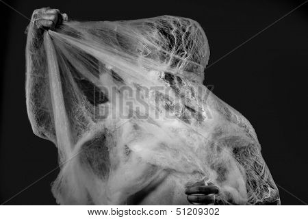 Web, naked man caught in spider web