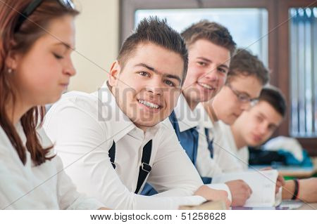 Cheerful students smiling in a schoolroom