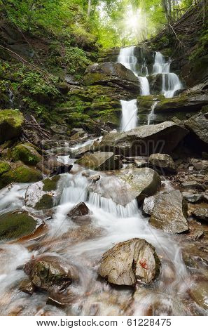 Waterfall in mountain forest. Waterfall Shipot, Carpathian Mountains, Ukraine