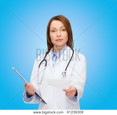 healthcare and medicine concept - calm female doctor with clipboard and stethoscope