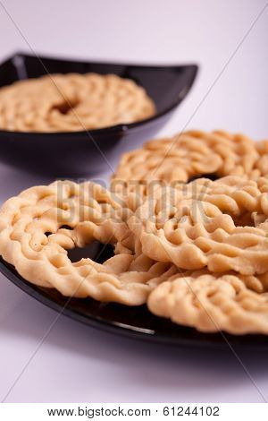 Murukku is a savoury snack from India