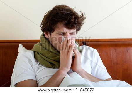 Man With Running Nose In Bed
