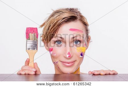 smiling happy creative artwork designer female holding brush