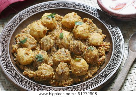 Kashmiri dum aloo is a deep fried baby potatoes cooked in yogurt