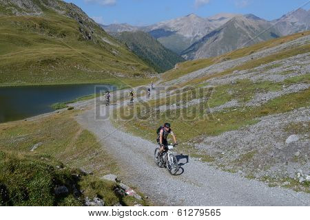 Mountain Bikers Riding Though Swiss Mountain Area