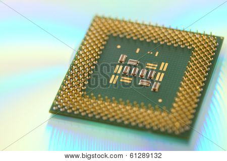 Computer CPU processor chip on green reflective background