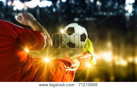 Close up image of footballer foot kicking the ball