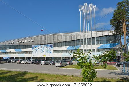 NOVOSIBIRSK, RUSSIA - AUGUST 20, 2014: Ice sports palace Siberia in a summer day. Built in 1964, the palace is the home rink for the hockey club Sibir, Continental Hockey League