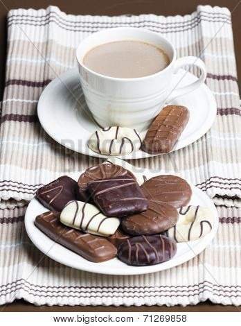 cup of coffee with chocolete biscuits