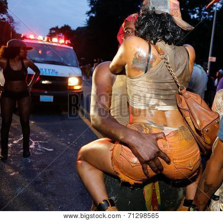Celebratory couple in front of NYPD van