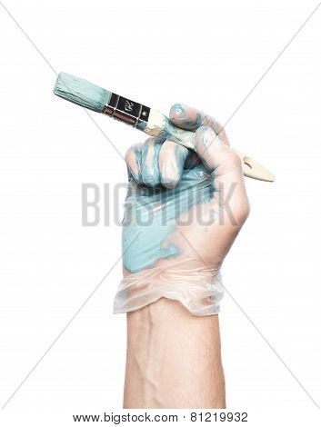 Hand holding a brush