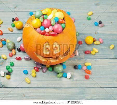 Jack o lantern pumpkin filled with candies