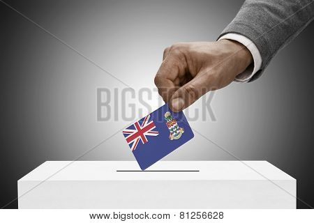 Black Male Holding Flag. Voting Concept - Cayman Islands