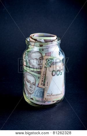 Ukrainian money in the jar
