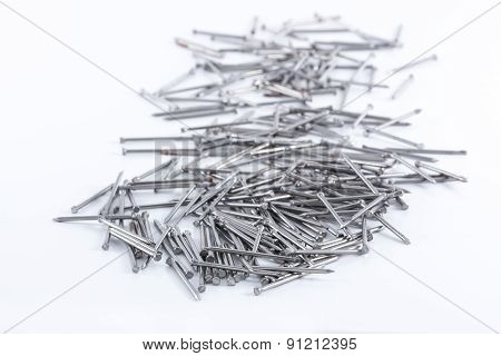 Nails & Panel Pins On White Surface