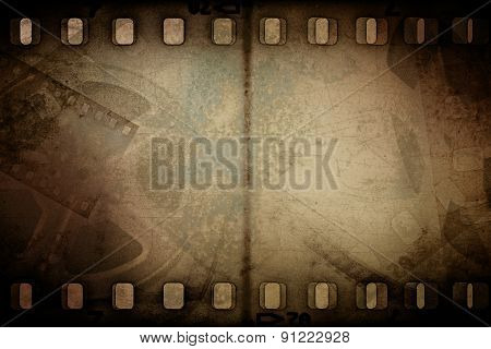 Grunge old motion picture reel with film strip. Vintage background