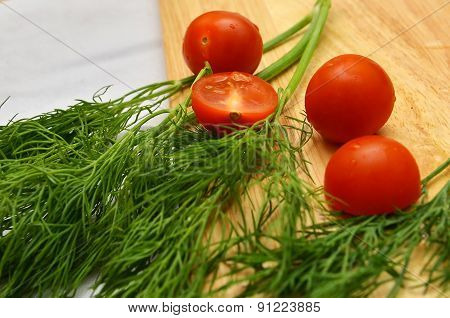 Cherry Tomatoes On The Branches Of Dill