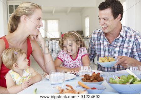 Family Enjoying Meal Together At Home