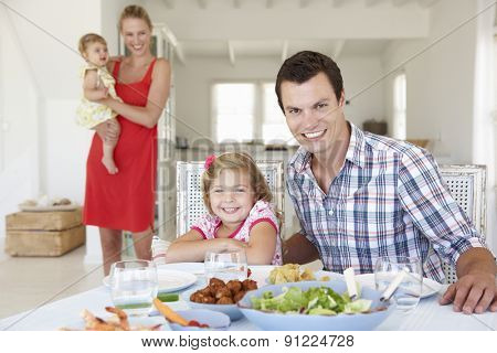 Family Enjoying Meal Together At Home