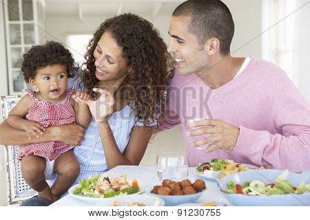 Family Enjoying Meal Together At Home