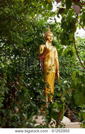 Golden Sculpture In Bushes. Golden Mount (wat Saket), Bangkok, Thailand.
