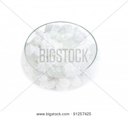 crystal sugar in a glass sugar bowl isolated on a white background