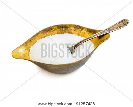 sugar in a metal sugar bowl isolated on a white background