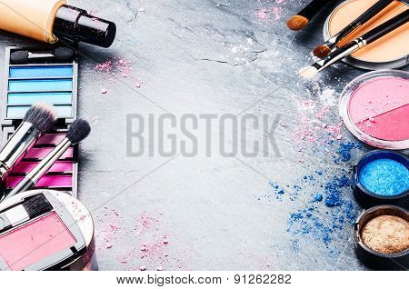 Various Makeup Products On Dark Background