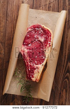 raw beef Rib bone  steak  on paper