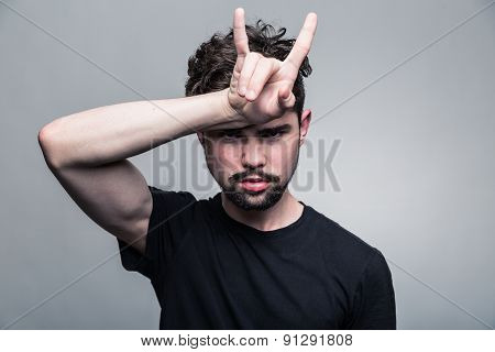 Portrait of brutal bearded man with horns