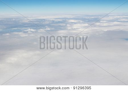 Aerial View Of Blue Sky And Cloud Top View From Airplane Window