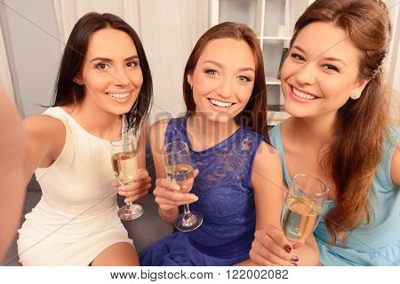 Pretty Girls Holding Glasses With Champagne And Making Selfie