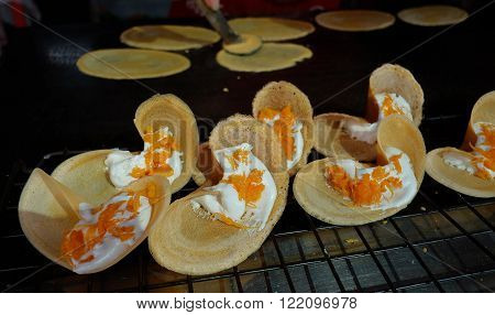 Khanom Beaung Thai or a kind of filled pancake Thai food or Thai Style Crisp Tart on tray Thailand - (Selective focus)