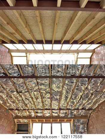 Fiberglass batt insulation between roof trusses at a house construction site