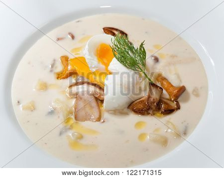 Traditional Czech potato soup Kulajda with roasted mushrooms