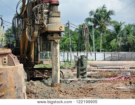 MALACCA, MALAYSIA - MARCH 12, 2015: Bore pile rig machine at the construction site in Malacca, Malaysia. The machine used to driven pile for building foundation work.
